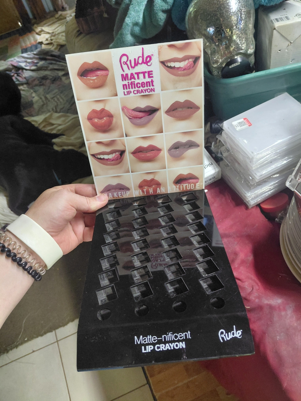 Rude Cosmetics display holds Matte-nificent Lip Crayons